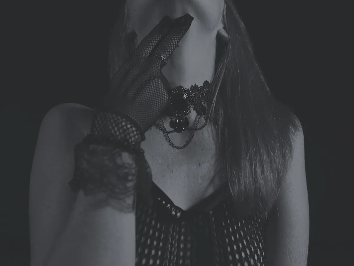 Cinematic boudoir portrait suggesting movement, intimacy and atmosphere