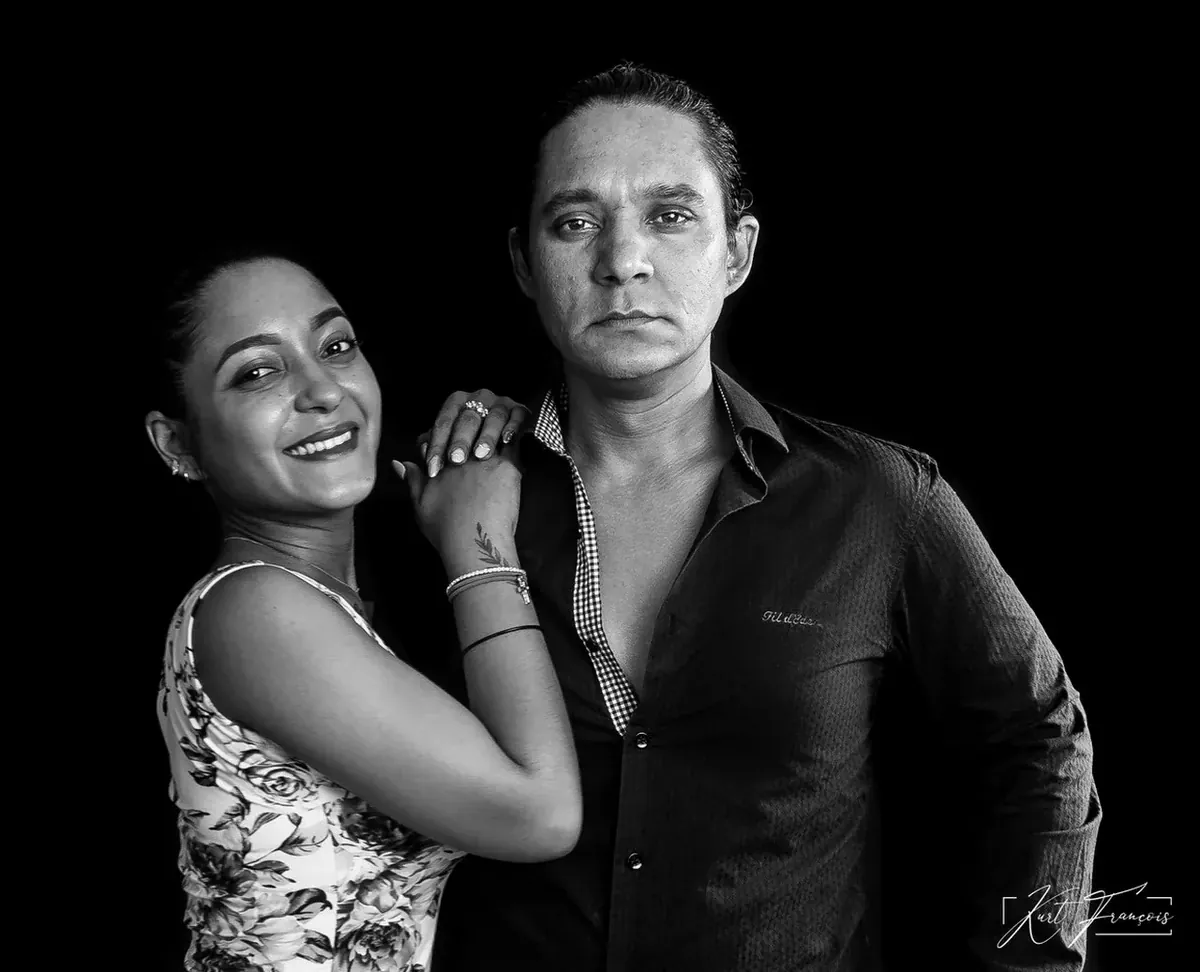 Black-and-white studio photograph of siblings Kurt François and Laetitia François together