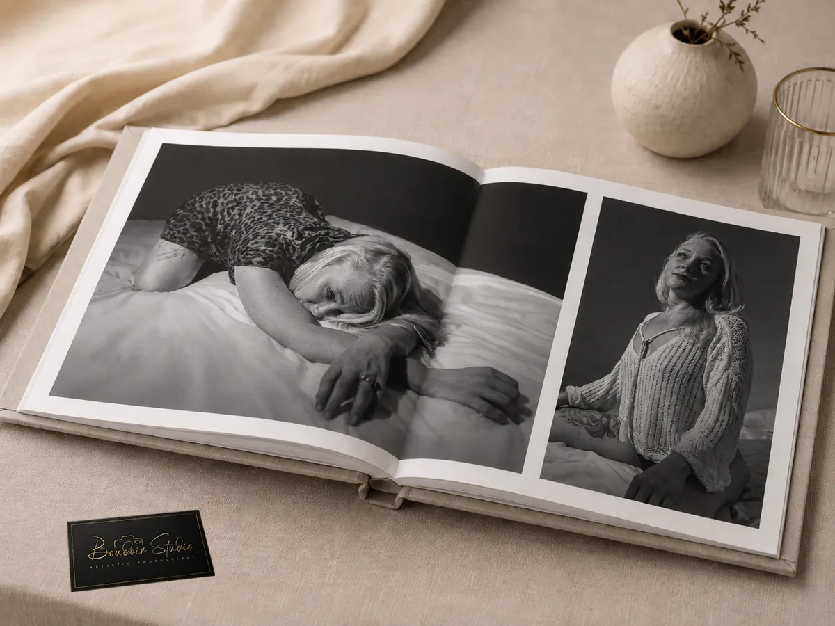 Open printed photo album displaying selected photography session images across its pages