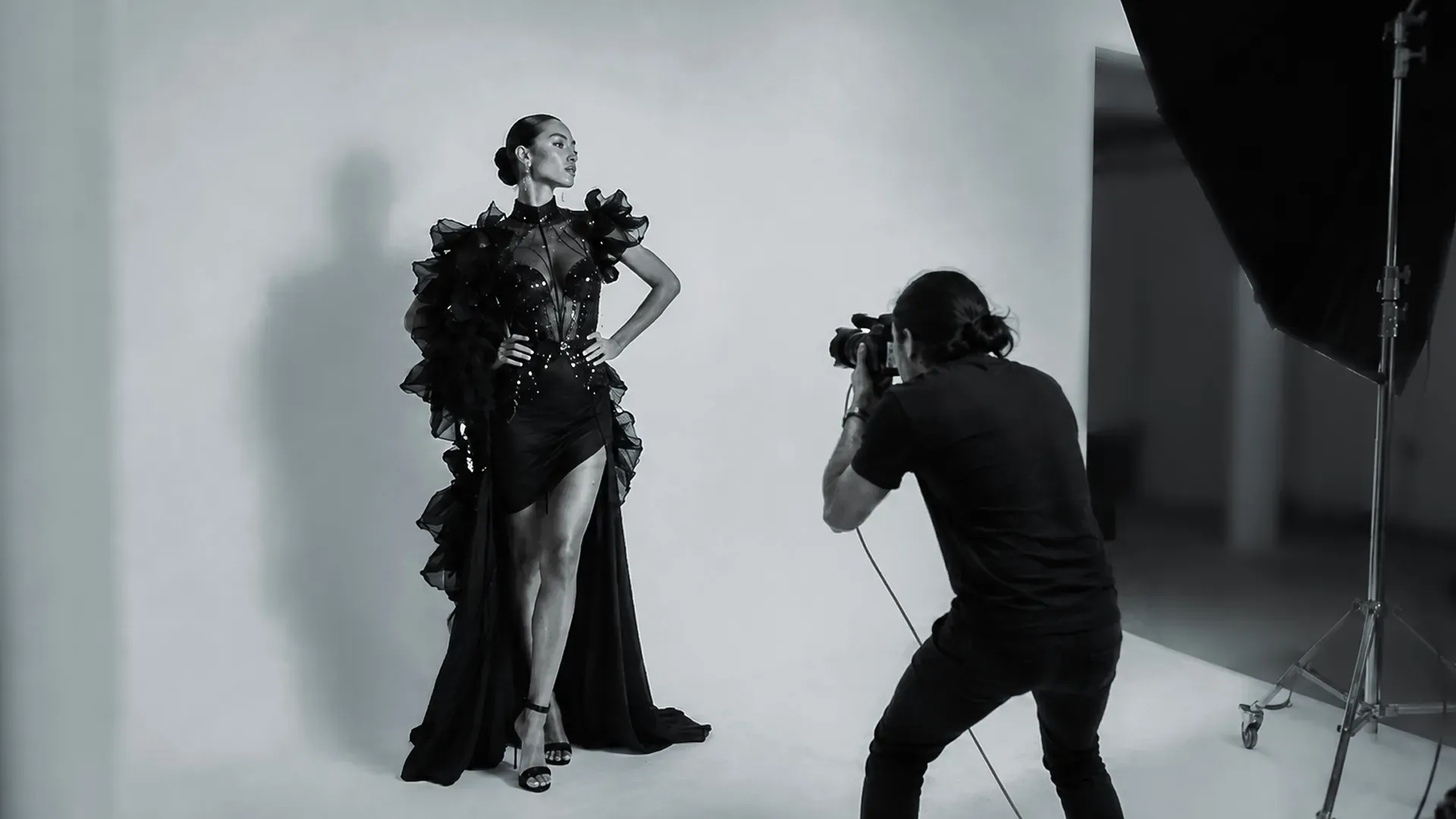 Photographer preparing a carefully lit studio photography session in Mauritius